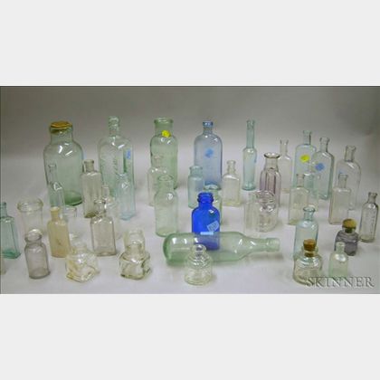 Forty-three Miscellaneous Aqua and Colorless Glass Bottles