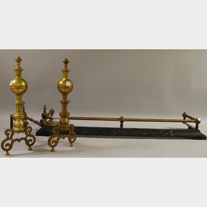Pair of Baroque-style Brass Andirons and a Late Victorian Brass and Cast Iron Fireplace Fender. 