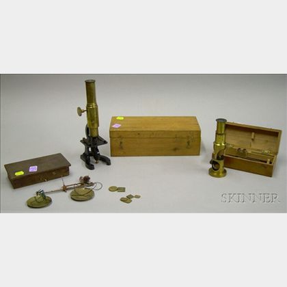 Two Brass-finished Microscopes and a Gold Scale