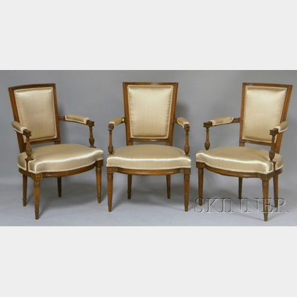 Set of Four Louis XVI Upholstered Carved Beechwood Armchairs and a Settee