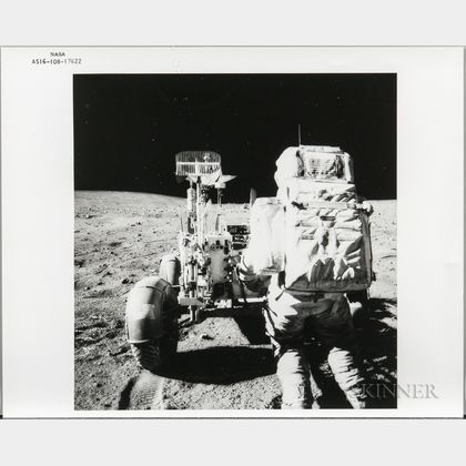 Apollo 16, On Moon, John Young Reaches for Tools.
