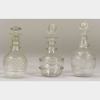 Three Blown Molded Colorless Glass Decanters