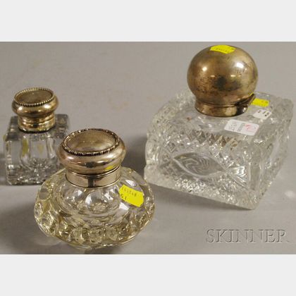 Three Sterling Silver Lidded Colorless Cut Glass Inkwells. Estimate $400-600