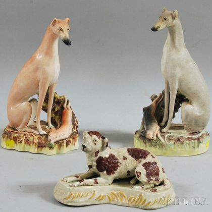 Two Large Staffordshire Pottery Whippet with Game Figurines and a Recumbent Spaniel Figure