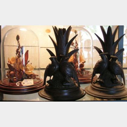 Pair of Victorian-style Dried Flower Studies under Glass Domes, and a Pair of Black Forest Carved Wood Figural Vases