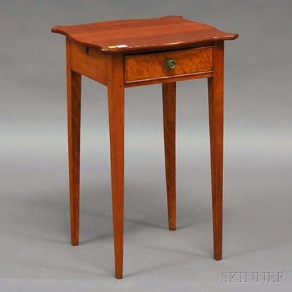 Federal Birch and Maple Serpentine-top Single-drawer Stand with Tapering Legs. Estimate $250-450