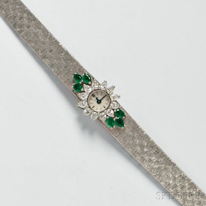 Lady's 18kt White Gold, Emerald, and Diamond Wristwatch, Piaget