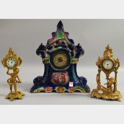 English Glazed Ceramic Cased Mantel Clock and Two Gilt-metal Cherub Figural Table Clocks