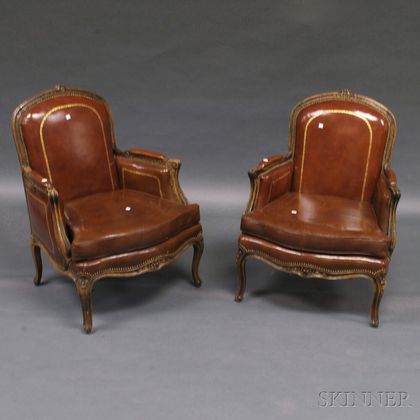 Pair of Louis XV-style Leather-upholstered Oak Bergeres