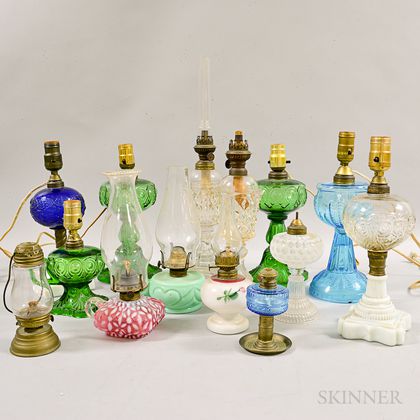 Fourteen Pressed Glass Oil Lamps