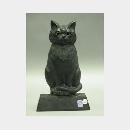 Black Painted Cast Iron Seated Cat Doorstop with Glass Eyes. 