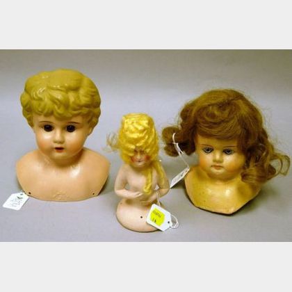 Two Doll Heads and a Half Doll