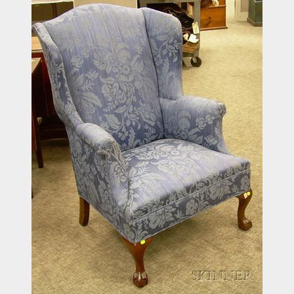 Chippendale-style Upholstered Carved Mahogany Wing Chair. 