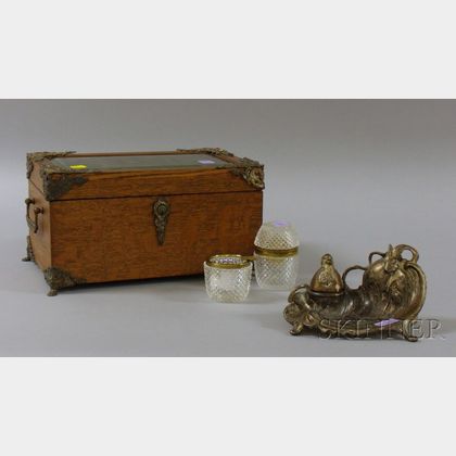 Late Victorian Brass-mounted Oak and Beveled Glass Jewel Casket, an Art Nouveau Silvered Metal Figural Inkwell,... 