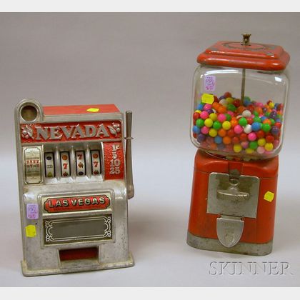 Vintage Oak Mfg. Co. Glass and Painted Cast Metal Gumball Machine and a "Nevada" Cast Metal Slot Machine