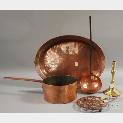 Four Pieces of Copper Kitchenware and a French Brass Candlestick