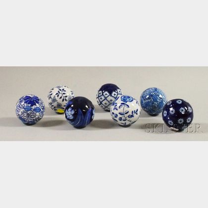 Seven Blue and White Carpet Balls