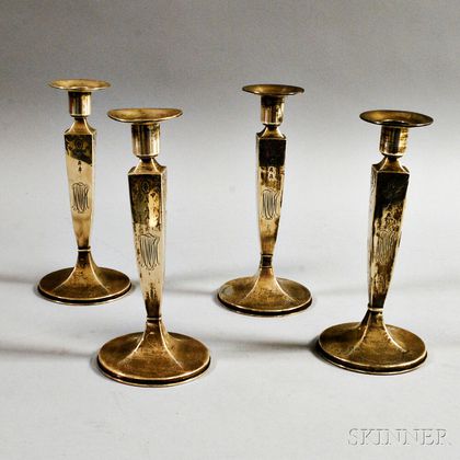 Four Sterling Silver Weighted Candlesticks