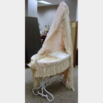 French White-painted Cast Iron Babys Bassinet with Mesh Canopy and Skirt. 