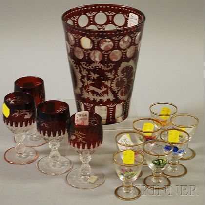 Large Bohemian Etched Ruby Flash Glass Tumbler and a Set of Four Cordials, and a Set of Seven Enameled Fish-decorated Glass Cordials. 