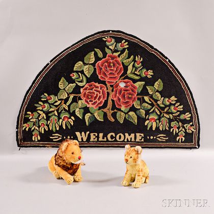 Two Vintage Steiff Lions and a Hooked "Welcome" Rug. Estimate $200-250