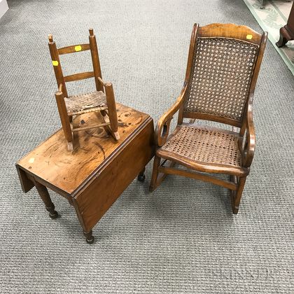 Miniature Federal-style Walnut Drop-leaf Table and Two Rocking Chairs. Estimate $150-250