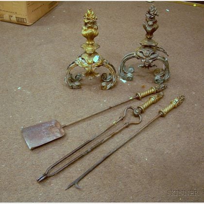 Pair of French Rococo-style Gilt Bronze Urn and Flame Chenets with a Set of Three Brass Fireplace Tools. 
