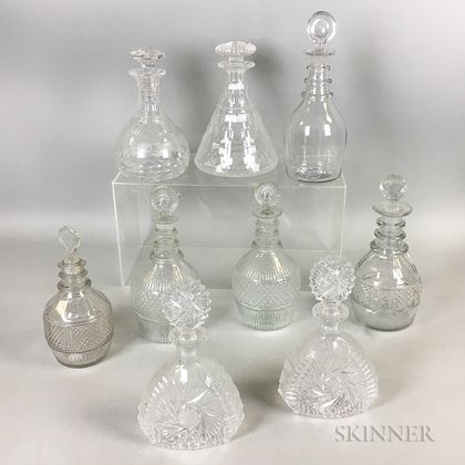 Nine Colorless Glass Decanters