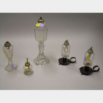 Two Colorless Glass Sandwich Whale Oil Lamps, a Miniature Peg Lamp, and a Pair of Small Whale Oil Lamps with Iron Bases.