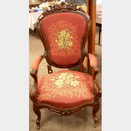 Victorian Rococo Revival Needlepoint Upholstered Carved Rosewood Parlor Armchair. 