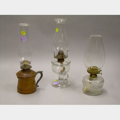 Two Colorless Glass Kerosene Lamps and a Turned Wood Base Lamp.
