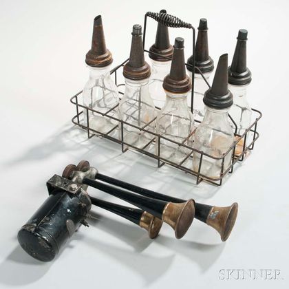 Vintage Auto Sparton Bugle and Seven Glass Oil Bottles with Rack
