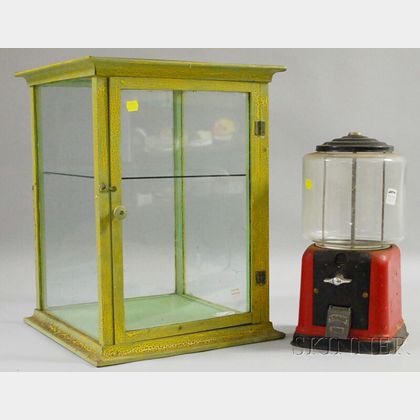 Vintage 5-cent Coin-op Countertop Gumball Machine and a Green over Yellow-painted Wood and Glass Countertop Display Cabinet