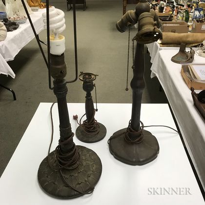 Small Handel Bronze Basketweave Lamp Base and Two Patinated Metal Lamp Bases. Estimate $400-600