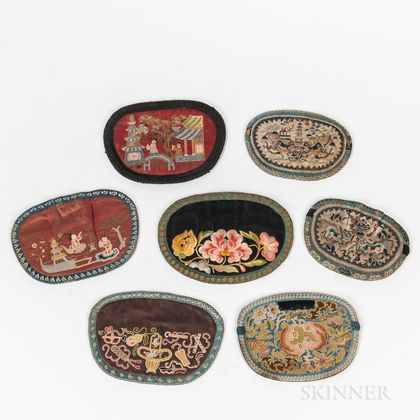 Seven Embroidered Oval Purses