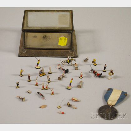 Pewter Rhode Island Ship Token and a Miniature Mexican Tin and Glass Display Box with a Collection of Painted Composition Figures