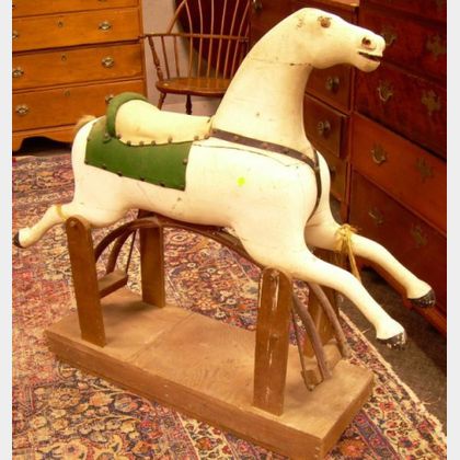 Carved and Painted Wooden Gliding Horse. 