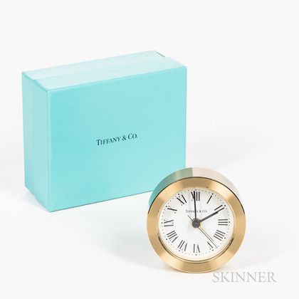 Boxed Tiffany & Co. Brass Alarm Clock. Estimate $100-150