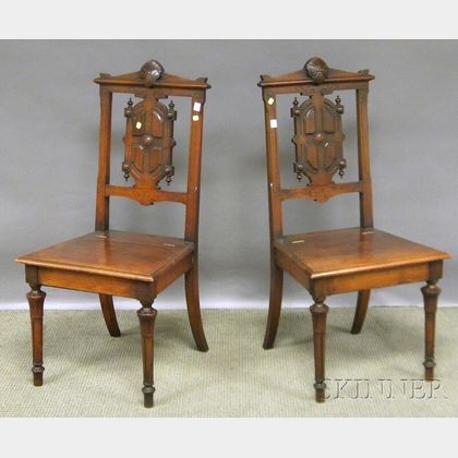 Pair of Victorian Renaissance Revival Carved Walnut Lift-seat Hall Chairs. 