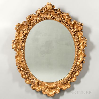 Pair of Carved and Gilded Oval Mirrors