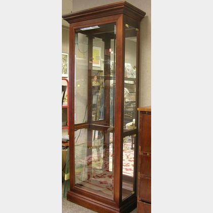 Modern Glazed Cherry-Finished Display Cabinet with Beveled Glass. 