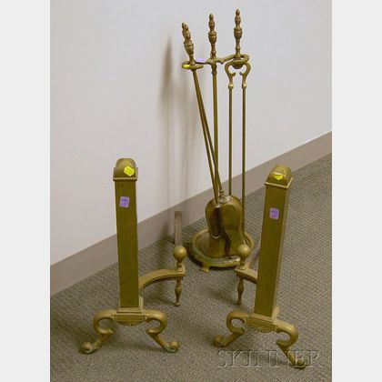 Pair of Neoclassical Brass Pillar-form Andirons and a Set of Three Brass Fireplace Tools with Stand. 
