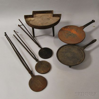 Three Wrought and Cast Iron Wafer Irons, a Stove Base, and Two Griddles