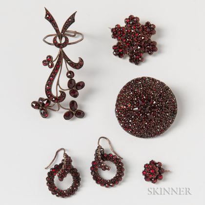 Two Garnet Brooches, a Large Garnet Ring, a Pair of Garnet Earrings, and a Small Garnet Pendant. Estimate $200-300