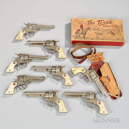 Six "Texan" and One "Texan Jr" Chromed Cast Iron Cap Guns and a Boxed Holster Set