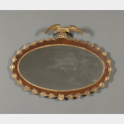 Regency Style Mahogany and Parcel-gilt Oval Mirror