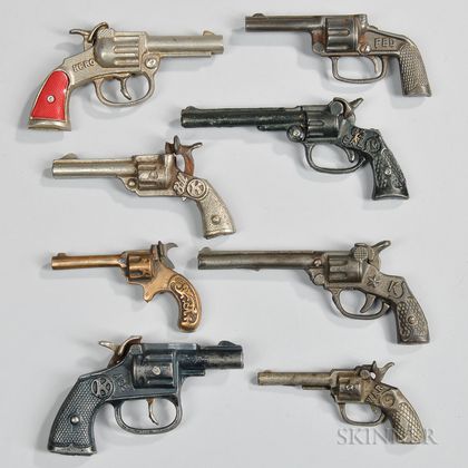 Eight Small Cast Iron Toy Cap Guns