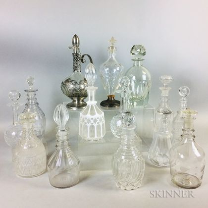 Fourteen Colorless Cut and Mold-blown Glass Decanters