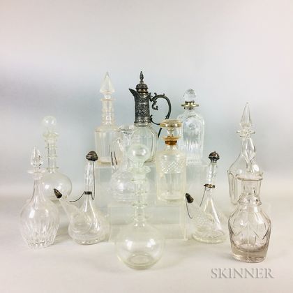 Twelve Colorless Cut Glass Decanters and Bottles