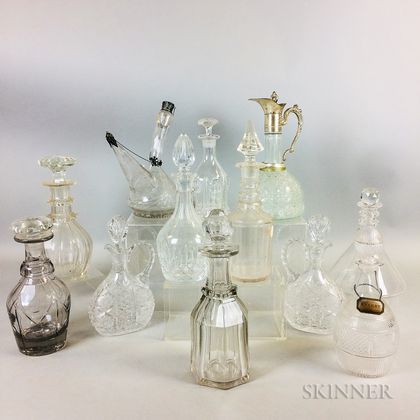 Twelve Cut and Etched Colorless Glass Decanters